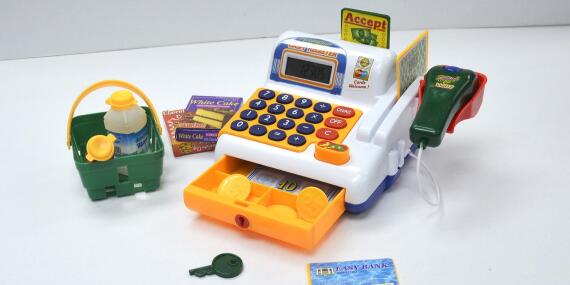 Toy cash register with toy money